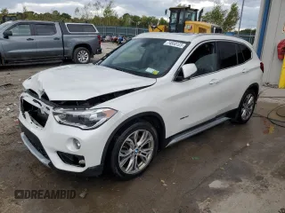 2017 BMW X1 xDrive28i z VIN WBXHT3C35H5F68041, wystawiony jako Copart lot #74858123 z przebiegiem 103 234 mil mil oraz Szkody całkowita. Historia ofert i sprzedaży dostępna na DreamBid. Obrazek 1.