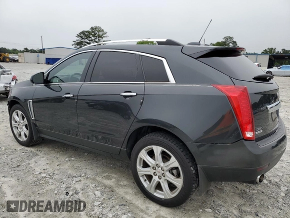 2015 Cadillac SRX Performance Collection with VIN 3GYFNCE38FS597717, listed as a Copart auction lot 57629615 with 102,689 mi miles and Salvage title. Bid and sale history available at DreamBid. Image 2.