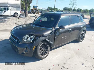 2015 MINI Countryman S with VIN WMWZC3C58FWT04316, listed as a IAAI auction lot 42525698 with 97,046 mi miles and . Bid and sale history available at DreamBid. Image 2.