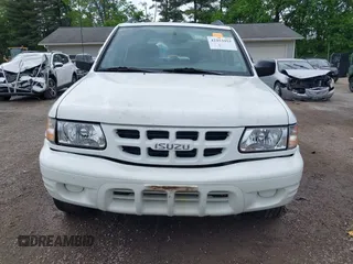 2000 Isuzu Rodeo z VIN 4S2DM58W6Y4312571, wystawiony jako IAAI lot #42253955 z przebiegiem 84 517 mil mil oraz . Historia ofert i sprzedaży dostępna na DreamBid. Obrazek 12.