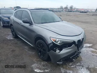 2021 Alfa Romeo Stelvio Ti z VIN ZASPAKBN0M7D15255, wystawiony jako IAAI lot #41442996 z przebiegiem 68 665 mil mil oraz . Historia ofert i sprzedaży dostępna na DreamBid. Obrazek 1.