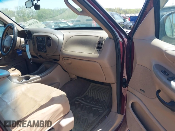 1998 Ford Expedition XLT z VIN 1FMRU17L9WLC23691, wystawiony jako IAAI lot #42107464 z przebiegiem 311 300 mil mil oraz . Historia ofert i sprzedaży dostępna na DreamBid. Obrazek 5.