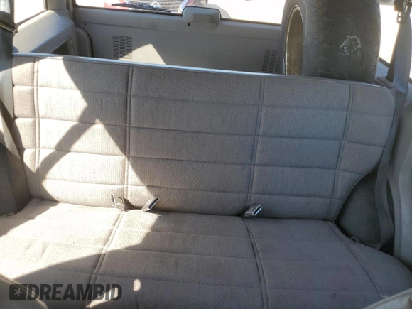 1995 Jeep Cherokee Sport with VIN 1J4FJ68S0SL646747, listed as a Copart auction lot 48772675 with 239,834 mi miles and Salvage title. Bid and sale history available at DreamBid. Image 10.