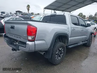 2016 Toyota Tacoma SR with VIN 3TMCZ5ANXGM010164, listed as a IAAI auction lot 41802736 with 201,697 mi miles. Bid and sale history available at carsss.com. Image 4.