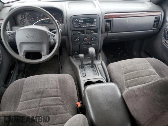 2000 Jeep Grand Cherokee Laredo z VIN 1J4GW48S1YC326453, wystawiony jako Copart lot #57332675 z przebiegiem 290 059 mil mil oraz Czysty tytuł • Clean title. Historia ofert i sprzedaży dostępna na DreamBid. Obrazek 8.