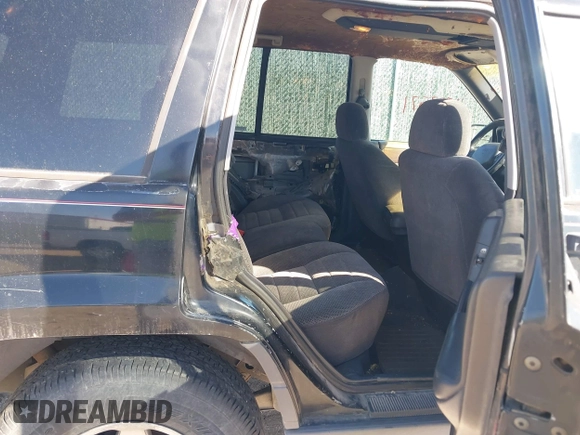 1997 Jeep Grand Cherokee Laredo with VIN 1J4GZ58S4VC633205, listed as a IAAI auction lot 41727571 with 201,228 mi miles. Bid and sale history available at carsss.com. Image 8.