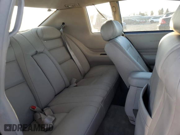 2002 Cadillac Eldorado z VIN 1G6EL12Y12B100821, wystawiony jako Copart lot #83495214 z przebiegiem 36 358 mil mil oraz Czysty tytuł • Clean title. Historia ofert i sprzedaży dostępna na DreamBid. Obrazek 10.