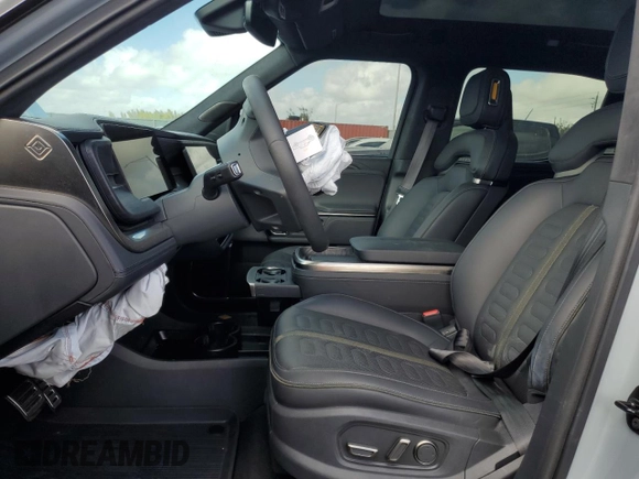 2023 Rivian R1T Adventure with VIN 7FCTGBAA2PN028983, listed as a Copart auction lot 45307015 with 220 mi miles and Salvage Title. Bid and sale history available at DreamBid. Image 7.