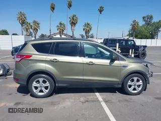2013 Ford Escape SE with VIN 1FMCU0G99DUC05901, listed as a IAAI auction lot 42194672 with 121,435 mi miles and . Bid and sale history available at DreamBid. Image 14.
