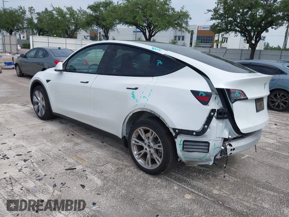2023 Tesla Model Y Long Range z VIN 7SAYGDEE0PA065534, wystawiony jako IAAI lot #42445868 z przebiegiem 22 638 mil mil oraz . Historia ofert i sprzedaży dostępna na DreamBid. Obrazek 3.