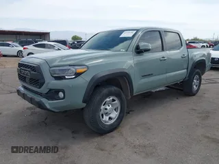 2022 Toyota Tacoma SR with VIN 3TMCZ5AN0NM507320, listed as a IAAI auction lot 42220296 with 33,342 mi miles and . Bid and sale history available at DreamBid. Image 2.