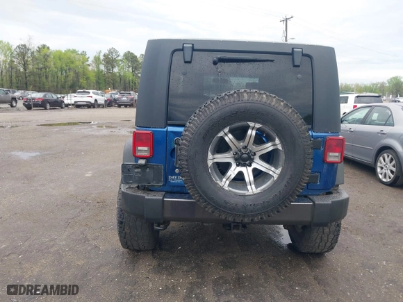 2010 Jeep Wrangler Unlimited Sport with VIN 1J4BA3H11AL144560, listed as a IAAI auction lot 42013032 with 226,233 mi miles. Bid and sale history available at carsss.com. Image 16.