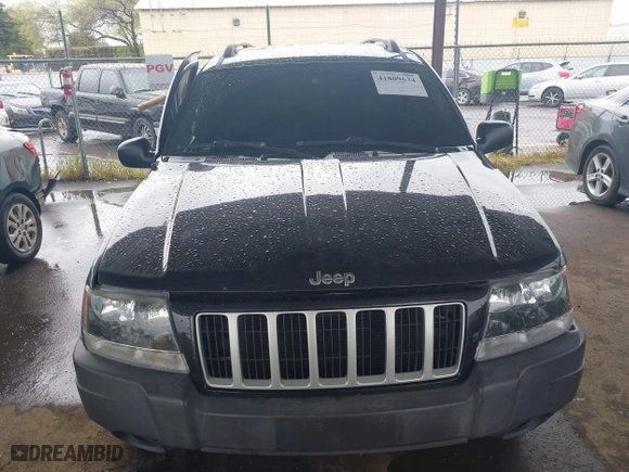 2004 Jeep Grand Cherokee Laredo with VIN 1J4GX48N94C435700, listed as a IAAI auction lot 41809624 with 147,413 mi miles. Bid and sale history available at carsss.com. Image 12.