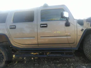 2003 Hummer H2 with VIN 5GRGN23U33H110037, listed as a IAAI auction lot 41339142 with 166,795 mi miles. Bid and sale history available at carsss.com. Image 13.