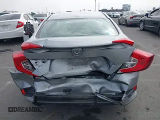 2017 Honda Civic LX with VIN 2HGFC2F5XHH562089, listed as a IAAI auction lot 42010207 with 99,809 mi miles and . Bid and sale history available at DreamBid. Image 16.