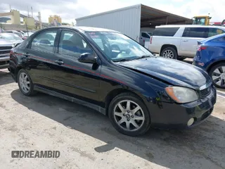 2005 Kia Spectra LX with VIN KNAFE122855161039, listed as a IAAI auction lot 41877885 with 102,641 mi miles. Bid and sale history available at carsss.com. Image 1.