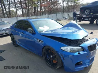 2013 BMW M5 with VIN WBSFV9C50DC773894, listed as a IAAI auction lot 41605598 with 99,803 mi miles. Bid and sale history available at carsss.com. Image 1.