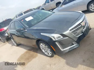 2015 Cadillac CTS Luxury RWD with VIN 1G6AR5SXXF0117520, listed as a IAAI auction lot 42040387 with 148,163 mi miles and . Bid and sale history available at DreamBid. Image 1.