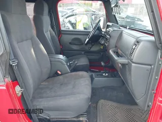 2003 Jeep Wrangler Sport with VIN 1J4FA49S13P320159, listed as a IAAI auction lot 41935699 with 212,355 mi miles. Bid and sale history available at carsss.com. Image 5.