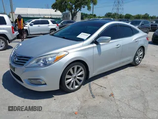 2013 Hyundai Azera z VIN KMHFH4JG6DA321882, wystawiony jako IAAI lot #42351891 z przebiegiem 59 690 mil mil oraz . Historia ofert i sprzedaży dostępna na DreamBid. Obrazek 2.