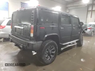 2003 Hummer H2 with VIN 5GRGN23U33H143023, listed as a Copart auction lot 84403414 with 0 mi miles and Salvage Title. Bid and sale history available at carsss.com. Image 3.