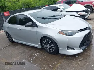 2018 Toyota Corolla L with VIN 5YFBURHE9JP823079, listed as a IAAI auction lot 42406902 with 148,244 mi miles and . Bid and sale history available at DreamBid. Image 1.