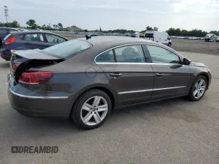 2014 Volkswagen CC R-Line with VIN WVWBP7AN9EE538276, listed as a Copart auction lot 64852674 with 143,474 mi miles and Salvage Title. Bid and sale history available at carsss.com. Image 3.