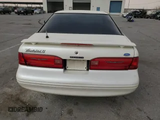 1997 Ford Thunderbird LX with VIN 1FALP62W5VH124101, listed as a Copart auction lot 47547695 with 148,828 mi miles and Salvage Title. Bid and sale history available at carsss.com. Image 6.