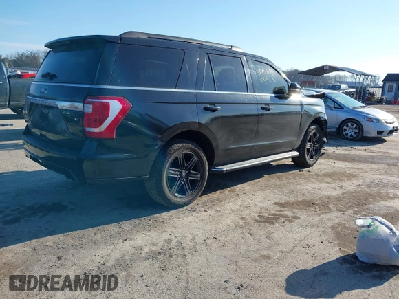 2021 Ford Expedition XLT with VIN 1FMJU1JT9MEA21621, listed as a IAAI auction lot 41458176 with 97,133 mi miles. Bid and sale history available at carsss.com. Image 4.