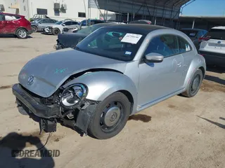 2013 Volkswagen Beetle 2.5L w/Sun/Sound/Nav with VIN 3VWJX7AT3DM663774, listed as a IAAI auction lot 41738146 with 98,064 mi miles and . Bid and sale history available at DreamBid. Image 17.