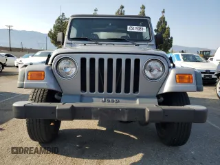 2000 Jeep Wrangler SE with VIN 1J4FA29P3YP770094, listed as a Copart auction lot 65419385 with 150,364 mi miles and Clean title. Bid and sale history available at DreamBid. Image 5.