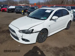 2015 Mitsubishi Lancer SE with VIN JA32V2FW9FU025402, listed as a IAAI auction lot 41646407 with 67,201 mi miles. Bid and sale history available at carsss.com. Image 2.