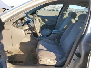 1996 Ford Taurus LX with VIN 1FALP53S9TG173438, listed as a Copart auction lot 77232114 with 89,789 mi miles and Clean title. Bid and sale history available at DreamBid. Image 7.