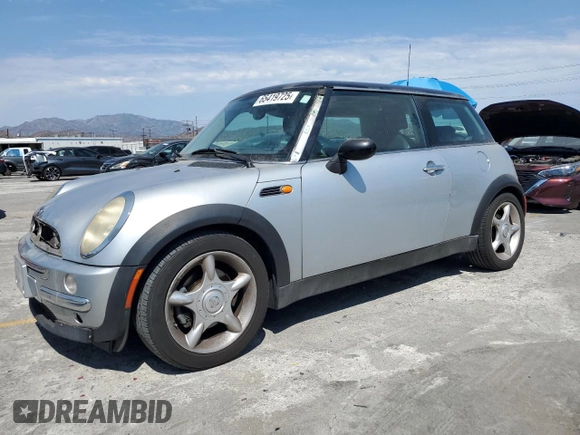 2003 MINI Hardtop with VIN WMWRC33453TE14909, listed as a Copart auction lot 65419725 with 111,960 mi miles and Salvage title. Bid and sale history available at DreamBid. Image 1.