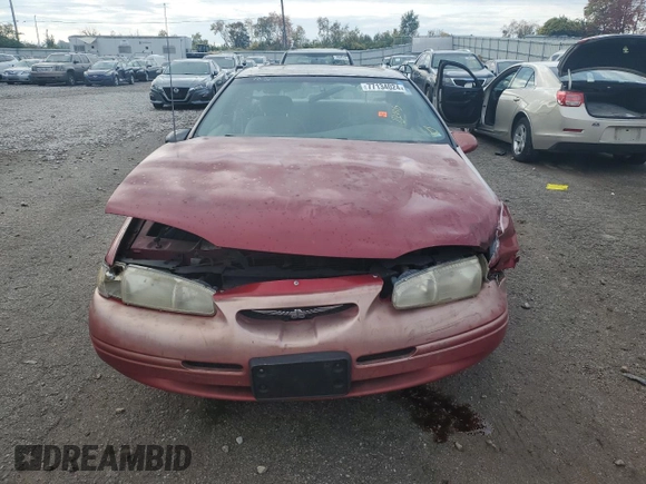 1996 Ford Thunderbird LX z VIN 1FALP62W7TH135632, wystawiony jako Copart lot #77134024 z przebiegiem 128 931 mil mil oraz Szkoda całkowita • Salvage title. Historia ofert i sprzedaży dostępna na DreamBid. Obrazek 5.