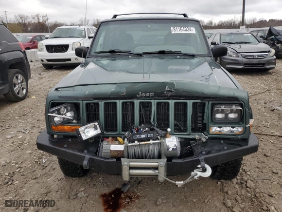 2000 Jeep Cherokee Police with VIN 1J4FF48SXYL244524, listed as a Copart auction lot 81164034 with 104,180 mi miles and Clean Title. Bid and sale history available at carsss.com. Image 5.