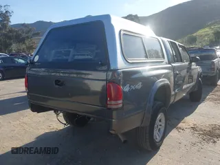 2003 Dodge Dakota SLT with VIN 1D7HG48N33S248568, listed as a IAAI auction lot 41834084 with 153,001 mi miles and . Bid and sale history available at DreamBid. Image 4.