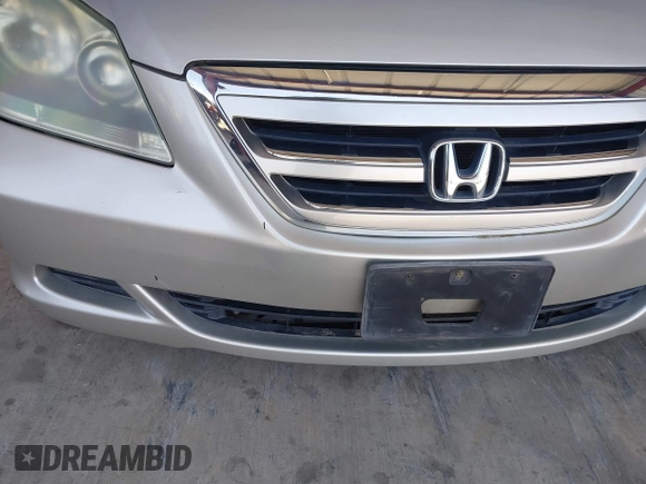 2005 Honda Odyssey EX-L with VIN 5FNRL38705B106488, listed as a IAAI auction lot 42545141 with 199,619 mi miles and . Bid and sale history available at DreamBid. Image 13.