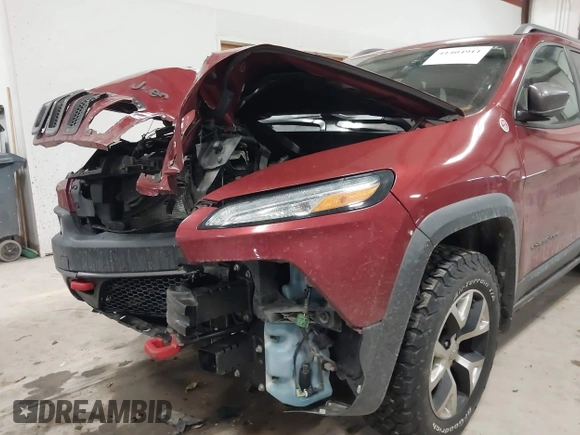 2015 Jeep Cherokee Trailhawk with VIN 1C4PJMBS7FW646577, listed as a IAAI auction lot 41404911 with 85,343 mi miles and . Bid and sale history available at DreamBid. Image 6.