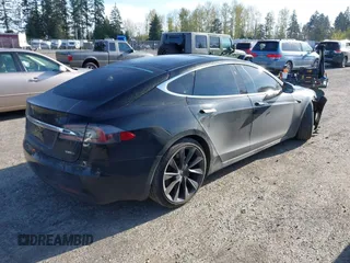 2018 Tesla Model S 75D with VIN 5YJSA1E28JF273809, listed as a IAAI auction lot 42029434 with 85,972 mi miles and . Bid and sale history available at DreamBid. Image 4.