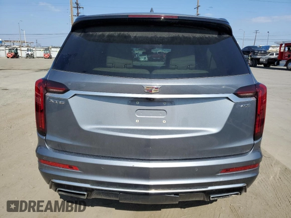 2020 Cadillac XT6 FWD Premium Luxury with VIN 1GYKPCRS5LZ201302, listed as a Copart auction lot 55103225 with 61,527 mi miles and Salvage Title. Bid and sale history available at carsss.com. Image 6.