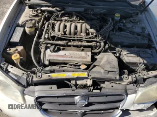 2001 Nissan Maxima GXE z VIN JN1CA31D61T818364, wystawiony jako Copart lot #67593624 z przebiegiem 158 601 mil mil oraz Szkoda całkowita • Salvage title. Historia ofert i sprzedaży dostępna na DreamBid. Obrazek 13.