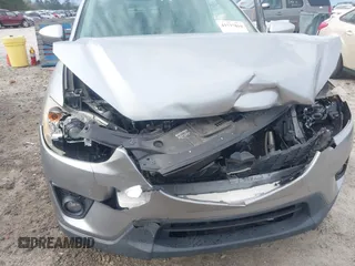 2015 Mazda CX-5 Touring with VIN JM3KE2CYXF0435583, listed as a IAAI auction lot 41737810 with 107,270 mi miles and . Bid and sale history available at DreamBid. Image 18.