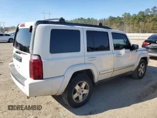 2010 Jeep Commander Sport with VIN 1J4RH4GK9AC113888, listed as a Copart auction lot 84553544 with 208,109 mi miles and Salvage title. Bid and sale history available at DreamBid. Image 3.