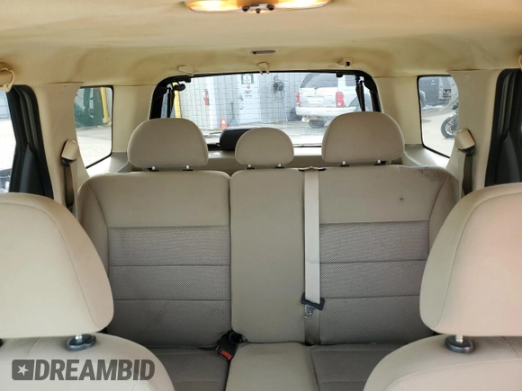 2005 Ford Escape XLT with VIN 1FMYU03165KC03784, listed as a Copart auction lot 64299225 with 185,033 mi miles and Salvage title. Bid and sale history available at DreamBid. Image 10.