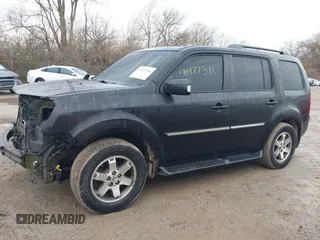 2011 Honda Pilot Touring with VIN 5FNYF4H94BB089930, listed as a IAAI auction lot 41477596 with 171,831 mi miles. Bid and sale history available at carsss.com. Image 15.