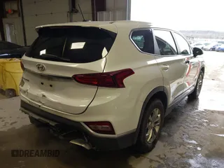 2019 Hyundai Santa Fe SE with VIN 5NMS23AD1KH063472, listed as a IAAI auction lot 41375650 with 64,496 mi miles and . Bid and sale history available at DreamBid. Image 4.