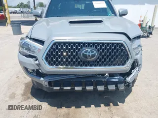 2019 Toyota Tacoma SR with VIN 3TMCZ5AN1KM274625, listed as a IAAI auction lot 42660593 with 163,460 mi miles and . Bid and sale history available at DreamBid. Image 6.