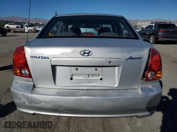2003 Hyundai Accent GL z VIN KMHCG45C63U413388, wystawiony jako Copart lot #88979235 z przebiegiem 240 928 mil mil oraz Szkoda całkowita • Salvage title. Historia ofert i sprzedaży dostępna na DreamBid. Obrazek 6.