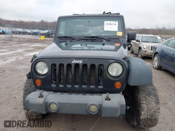 2008 Jeep Wrangler Unlimited X with VIN 1J4GA39138L641138, listed as a IAAI auction lot 41986230 with 215,026 mi miles. Bid and sale history available at carsss.com. Image 13.